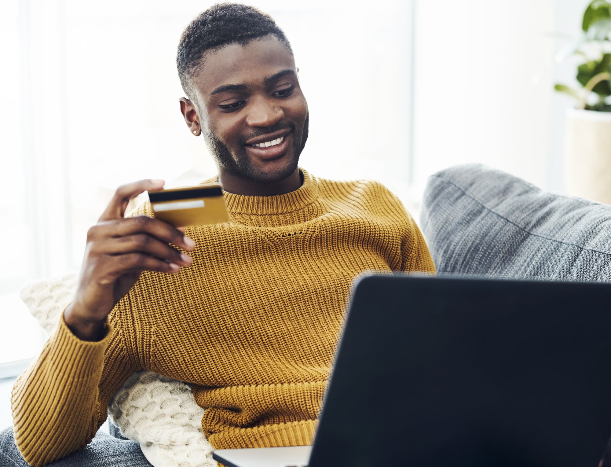 a man holding a laptop