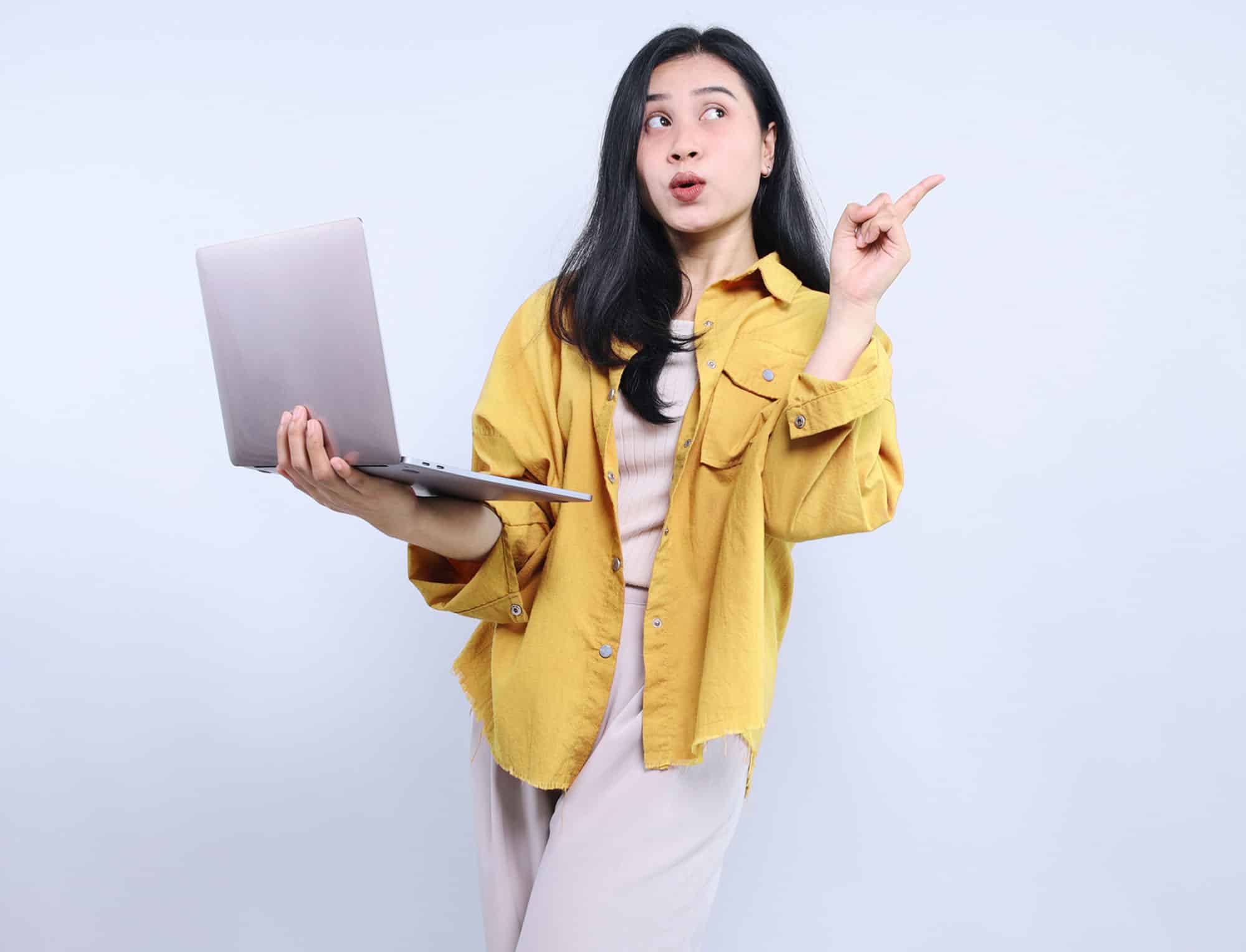 a woman standing in front of a coat